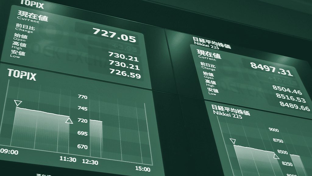 Electronic market boards showing index values and price changes